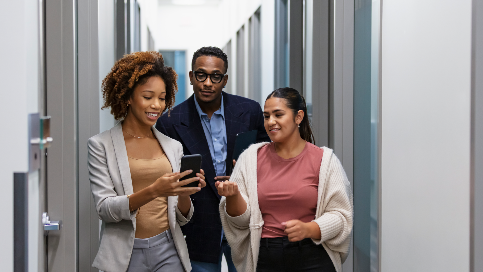 Office employees checking out RingCentral mobile app voice features