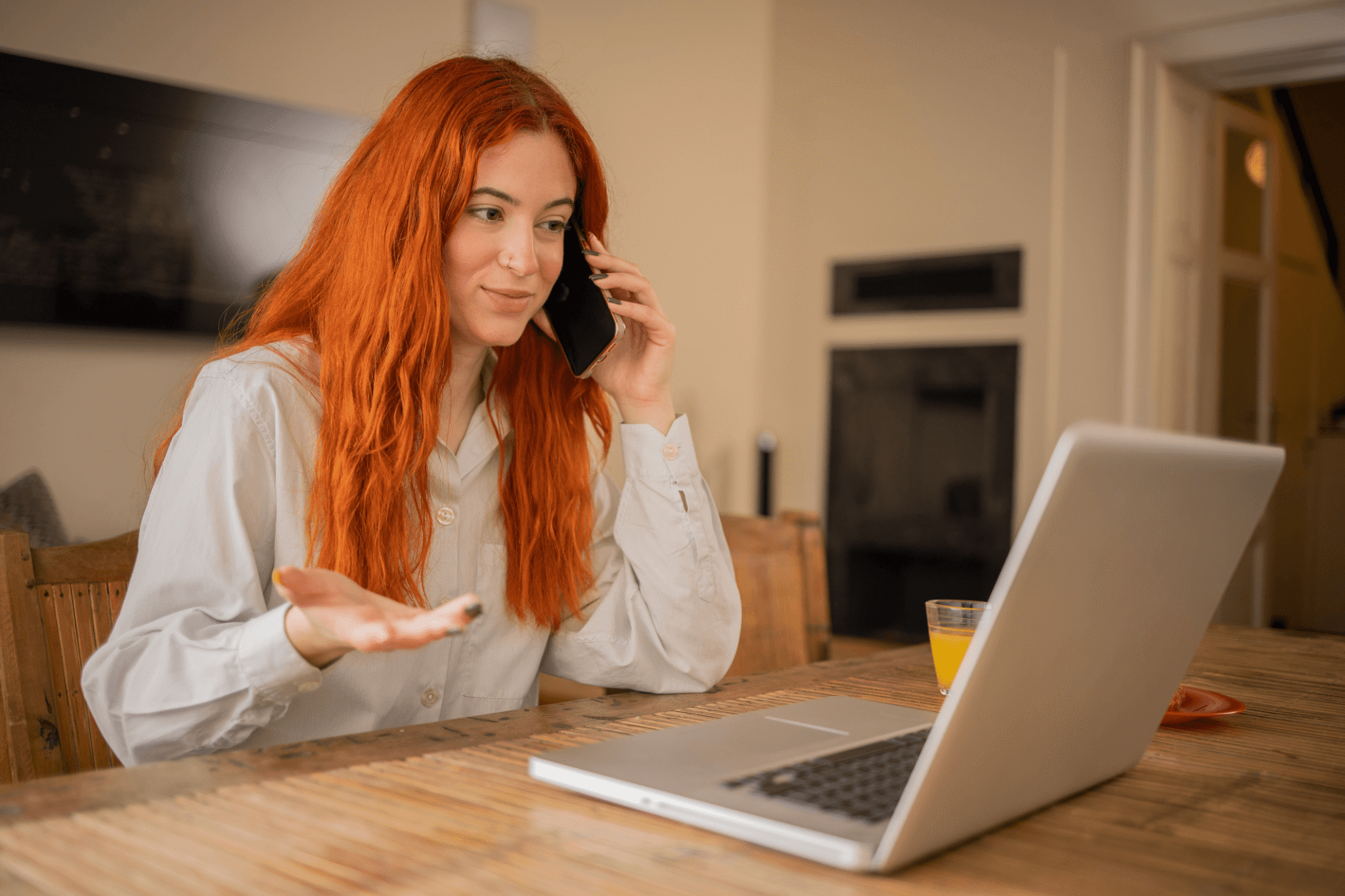 a salesperson on a RingCentral phone call while looking at her laptop