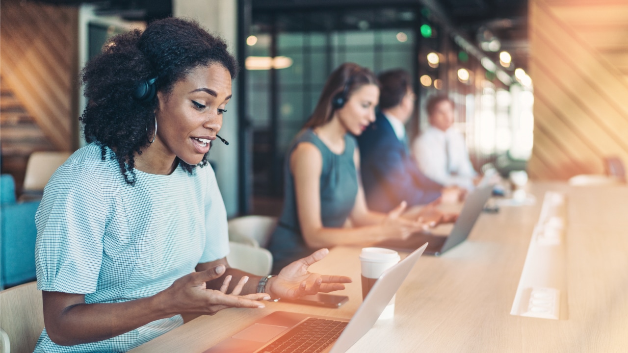 Customer rep woman sitting at desk
