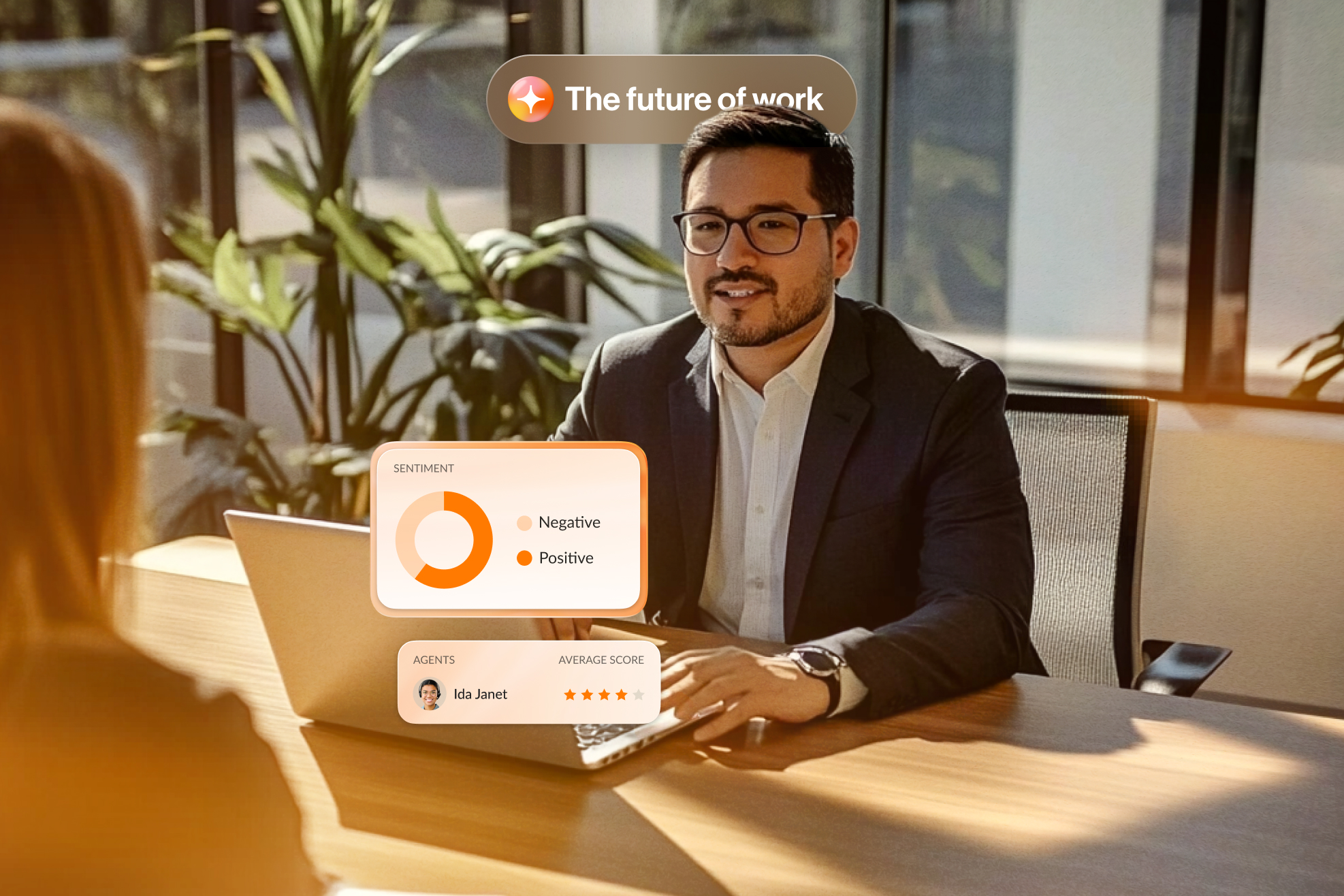 Man working at desk across from woman