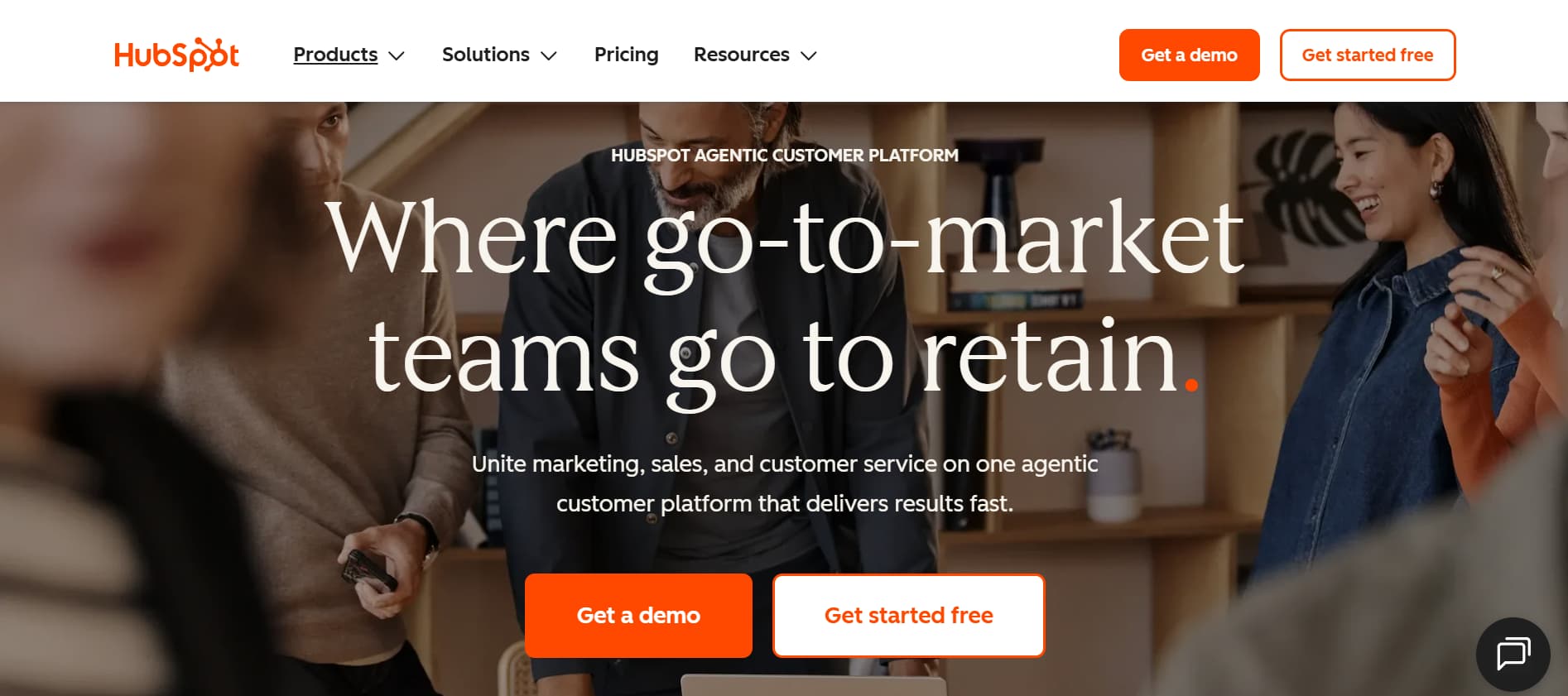 HubSpot homepage promoting an agentic customer platform with team collaboration, demo, and get started buttons displayed.